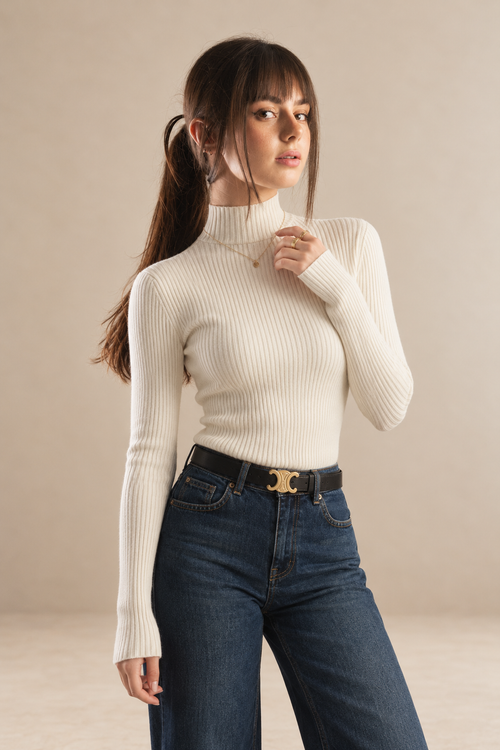 Amelie women's white ribbed roll neck jumper with long sleeves and a fitted silhouette — front three-quarter view.