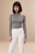 Celeste women's Black cropped roll neck top — front view.