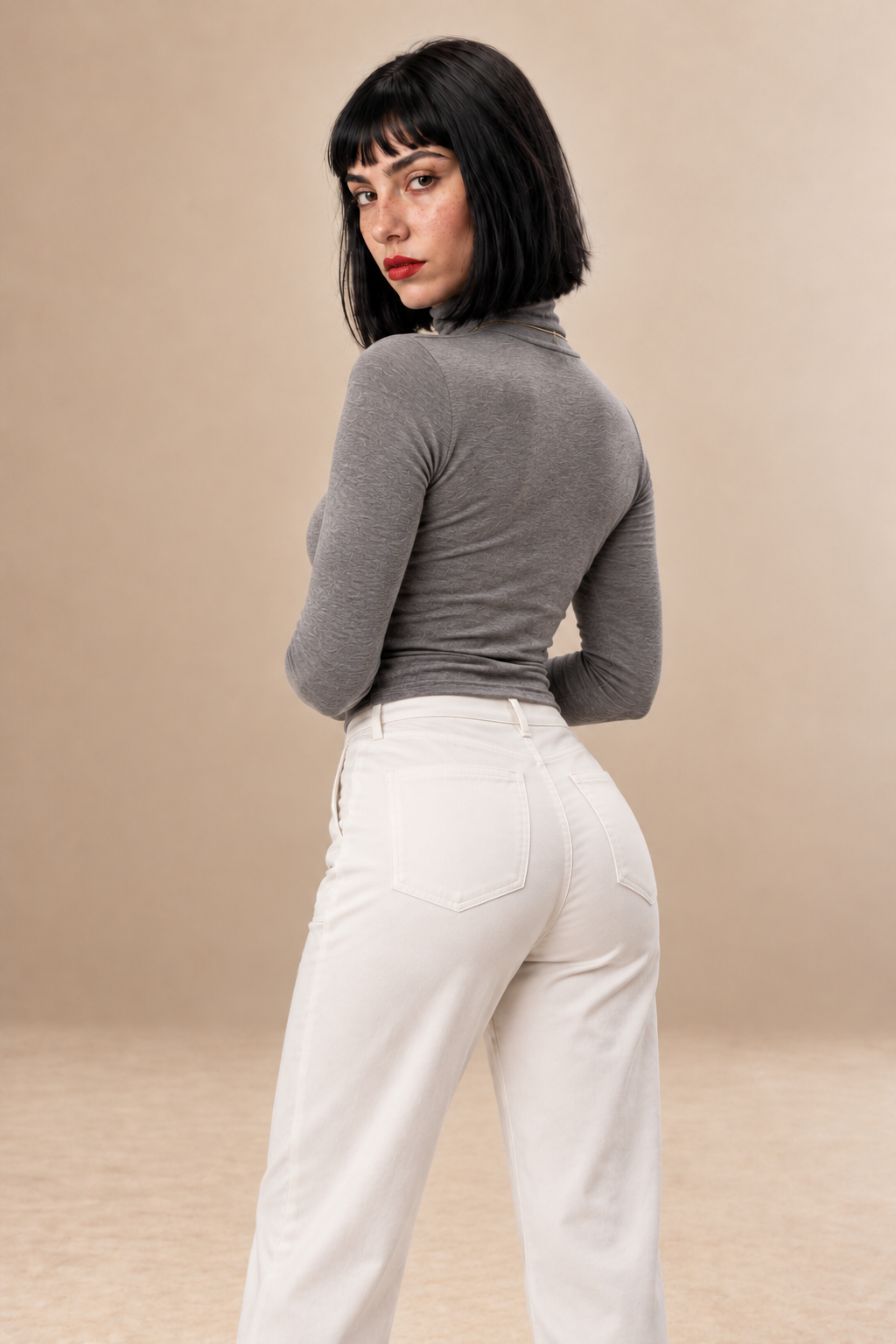 Celeste women's Black cropped roll neck top — back view.