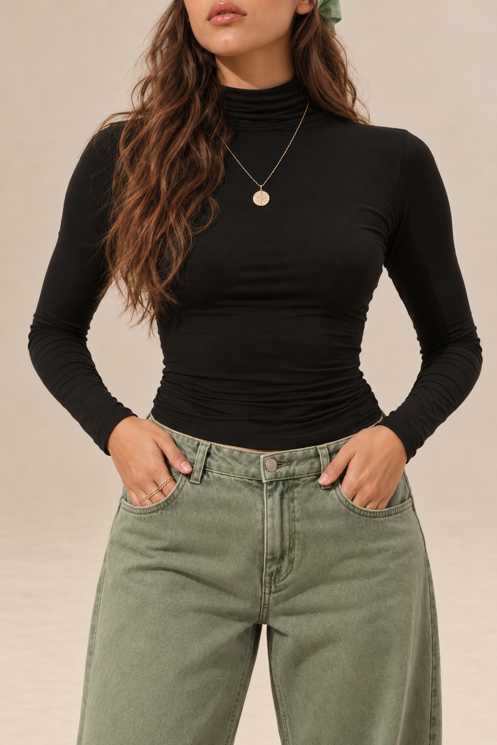 Elara women's black long-sleeve roll neck top with a high neckline, fitted silhouette and plain finish, front detail.