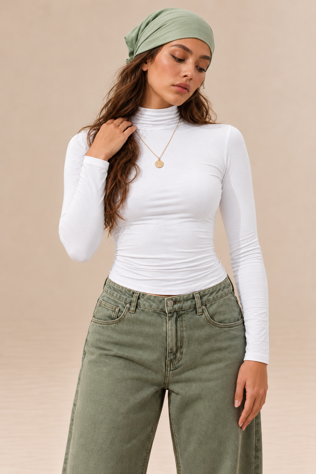 Elara women's white long-sleeve roll neck top with a high neckline, fitted silhouette and plain finish, shown from the front.