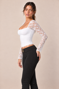 Liora women's lace sleeve crop top in white, three-quarter front view.