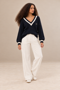 Margot women's navy blue knitted V neck jumper with cream contrast stripes — full-length front view.