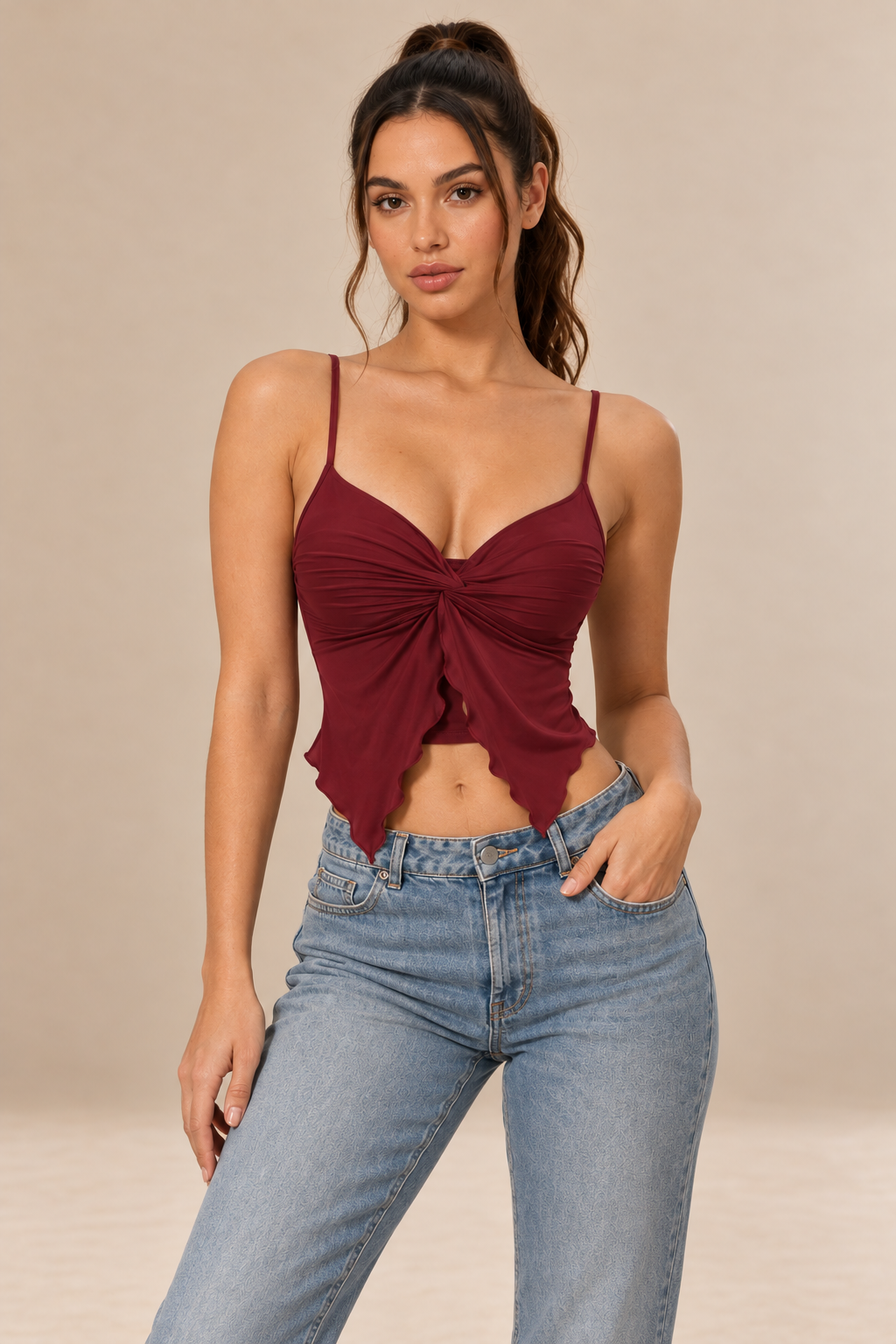 Nora women's twist front cami top in claret, shown from the front with slender straps, a V-neckline, gathered fabric and a pointed asymmetric hem.